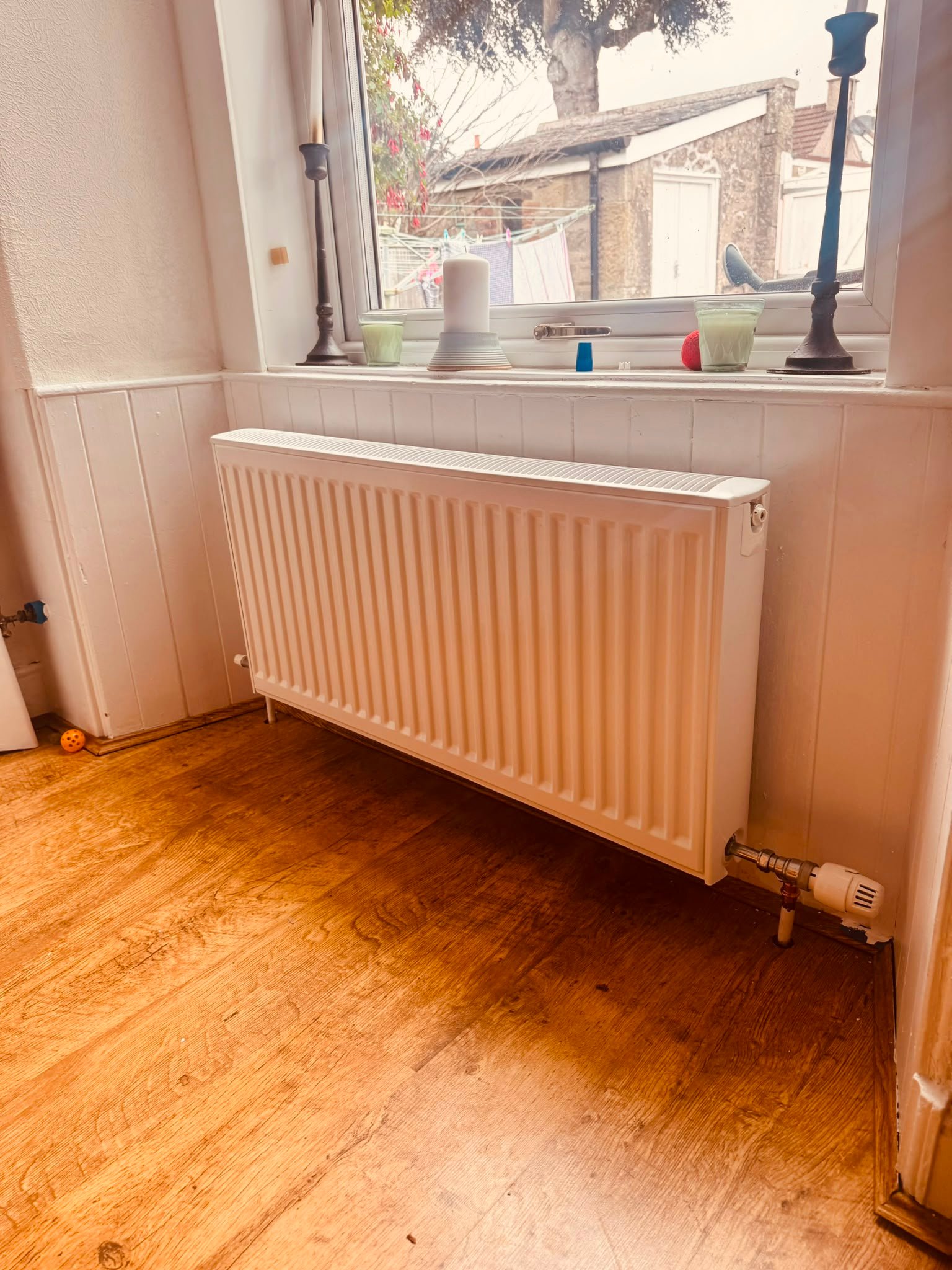New radiator beneath window after replacement