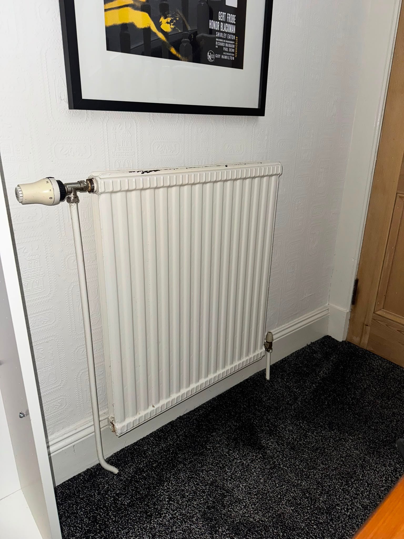 Old hallway radiator before replacement
