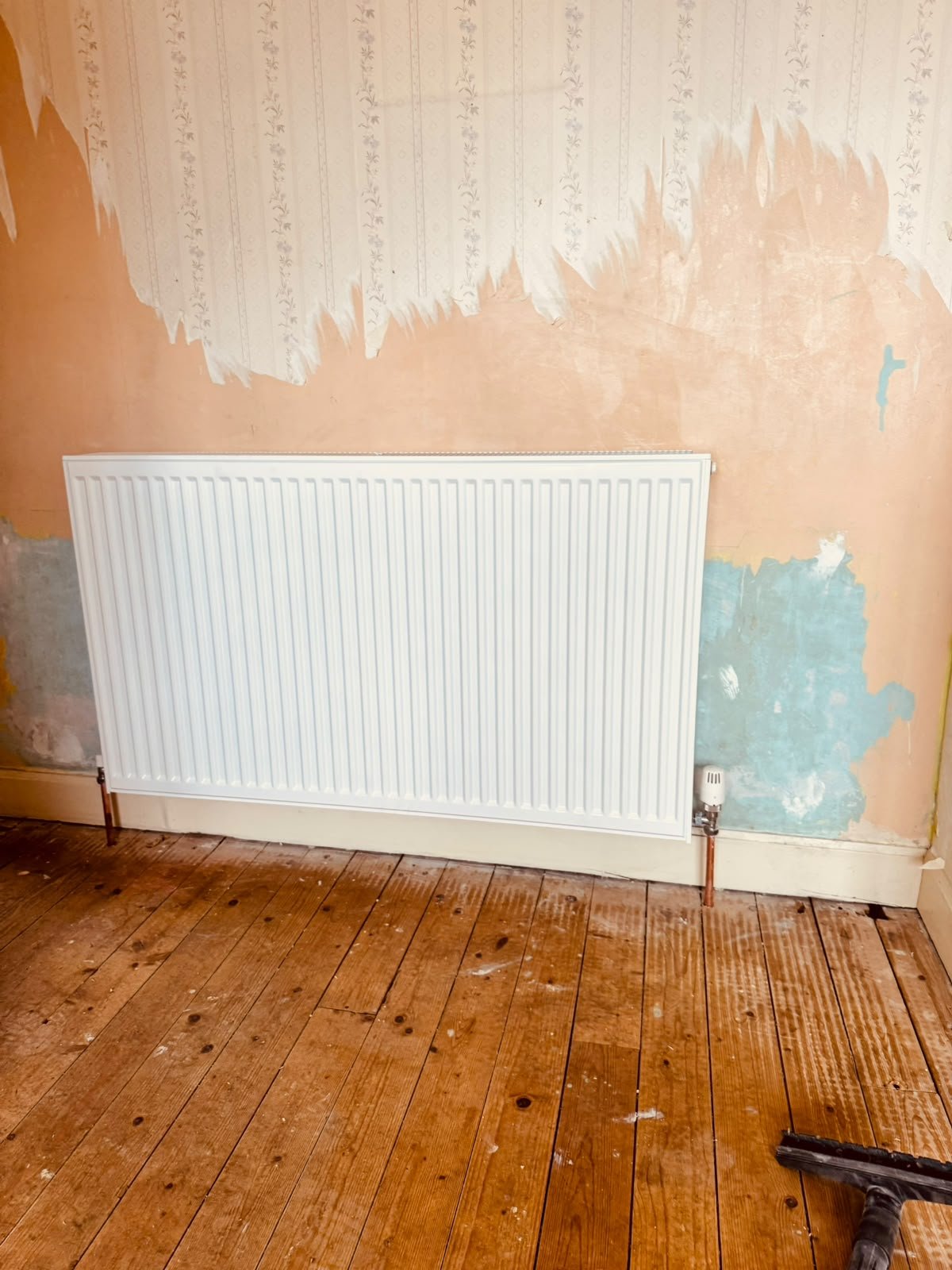 New radiator fitted as part of heating renovation