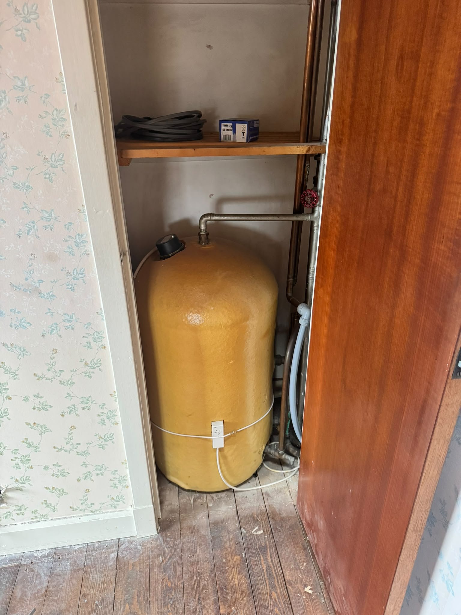 Old water tank before heating system upgrade